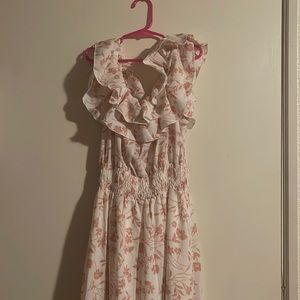 Size M. This dress color is white with pink flowers. It is off shoulder.